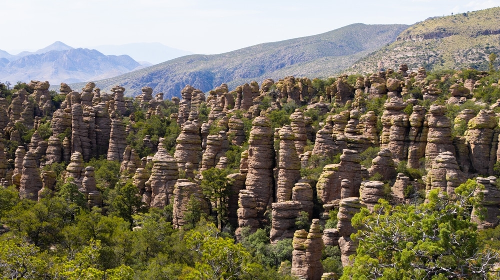 Arizona's,Chiricahua,National,Monument,Rocky,Formations,With,Mountains,Behind,Them,