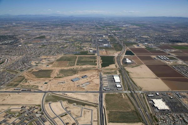 Aerial of growth and development along Interstate near Goodyear looking east towards Phoenix, Arizona