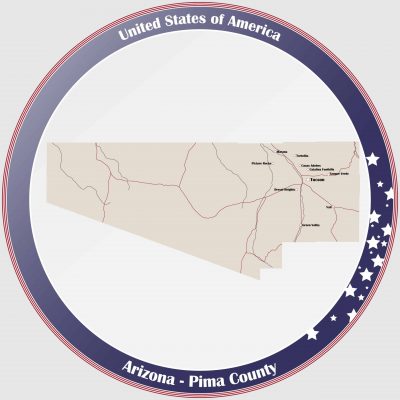 Round button with detailed map of Pima County in Arizona, USA.