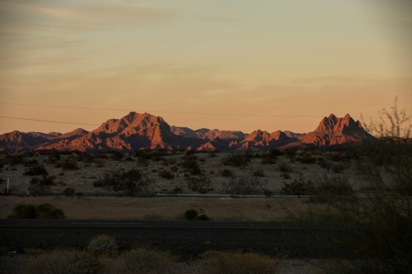 Sunset,Light,Shines,On,The,Desert,Landscape,And,Mountains,Of